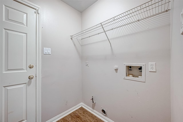 washroom featuring hookup for an electric dryer, hookup for a washing machine, hookup for a gas dryer, and wood-type flooring