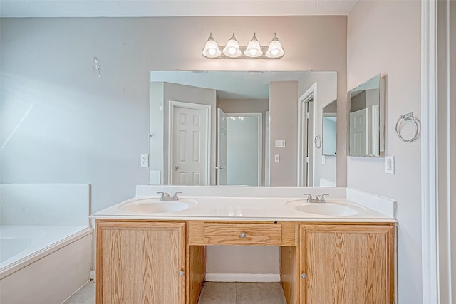 bathroom featuring a tub to relax in, tile patterned flooring, and vanity