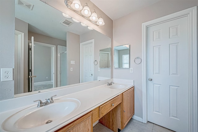 bathroom with tile patterned flooring, vanity, and a shower with shower door