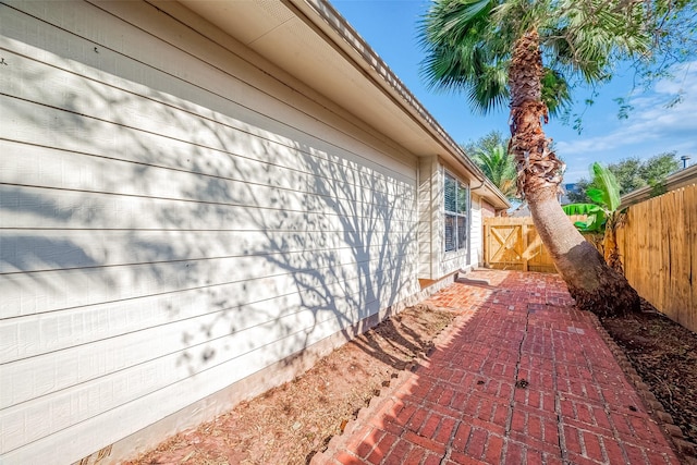 view of side of property with a patio