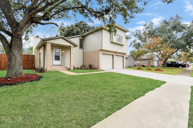 view of front facade with a front yard and a garage