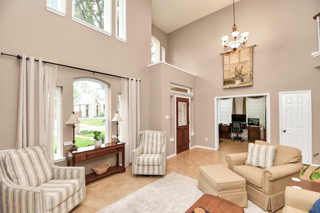 tiled living room featuring a chandelier and high vaulted ceiling