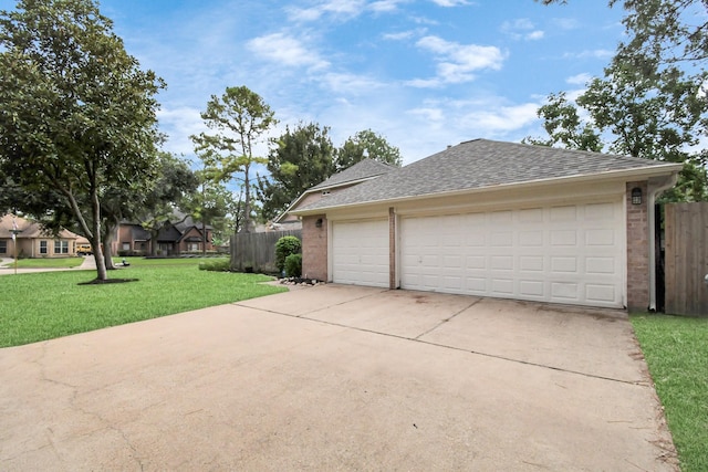 garage featuring a lawn