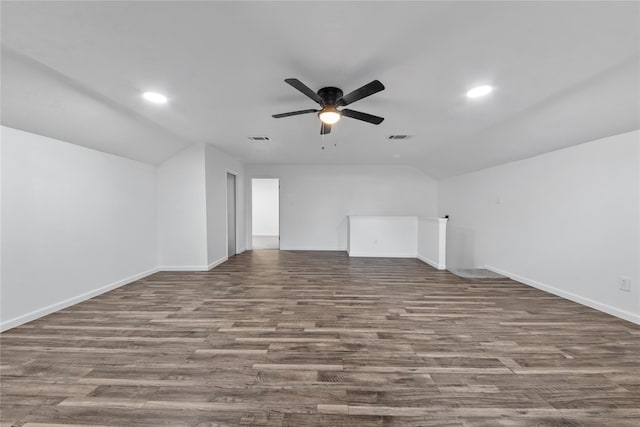 unfurnished living room featuring dark hardwood / wood-style floors, ceiling fan, and lofted ceiling