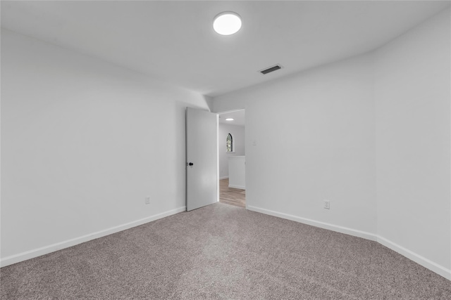 empty room featuring carpet flooring