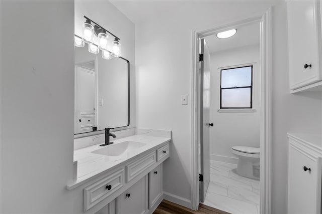 bathroom with vanity and toilet