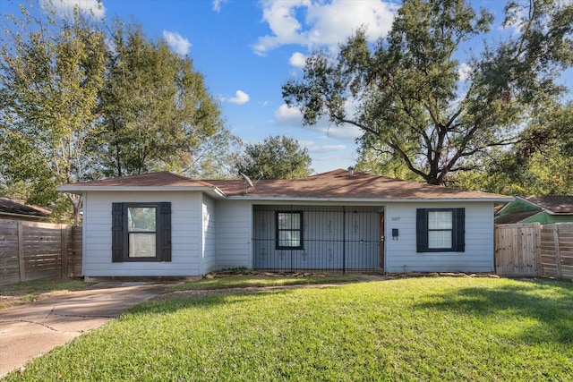 ranch-style home with a front lawn