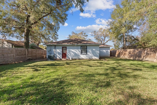 5107 Dickens Rd, Houston, TX 77021 - back of house featuring a lawn and central air condition unit