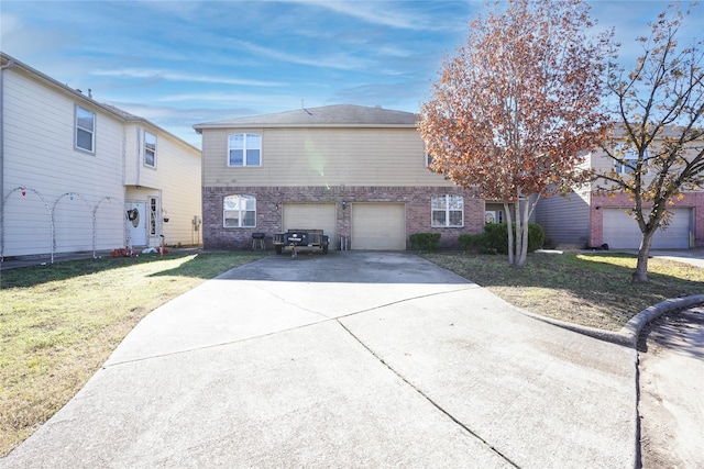 view of front of house featuring a garage and a front lawn