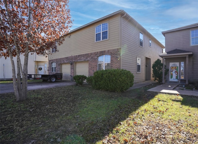 view of front facade with a front yard and a garage