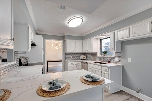 kitchen featuring sink, white cabinetry, ornamental molding, and stainless steel appliances