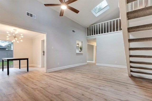 unfurnished living room featuring high vaulted ceiling, light wood-type flooring, ceiling fan with notable chandelier, and ornamental molding