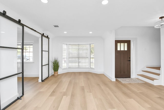 entryway featuring light wood-type flooring and a wealth of natural light