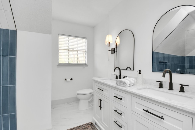 bathroom with toilet and vanity