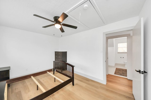 bedroom with ceiling fan and wood-type flooring