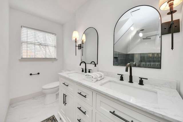 bathroom featuring toilet and vanity