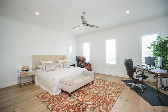 bedroom with ceiling fan, light hardwood / wood-style floors, crown molding, and multiple windows