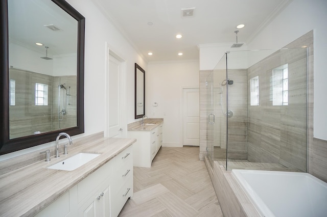 bathroom featuring a wealth of natural light, crown molding, and independent shower and bath