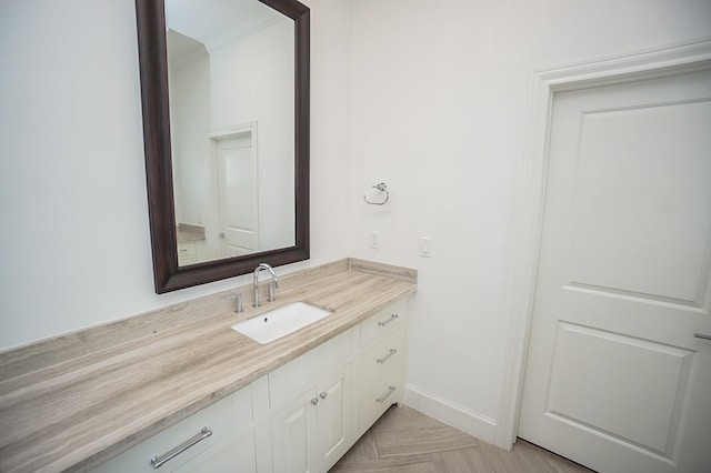 bathroom with vanity and parquet floors