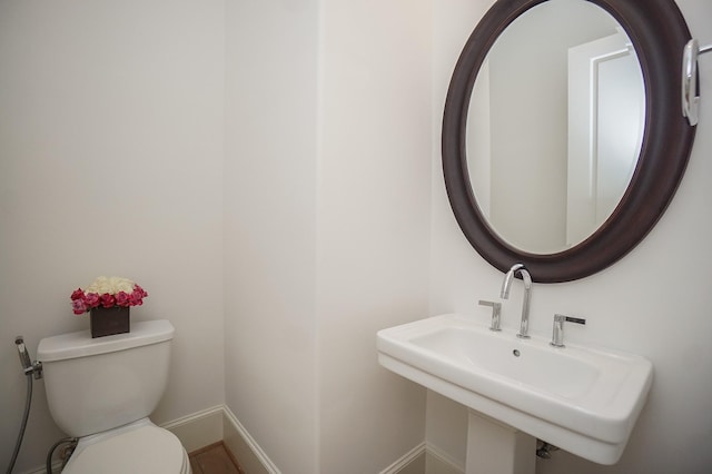 bathroom with toilet and sink