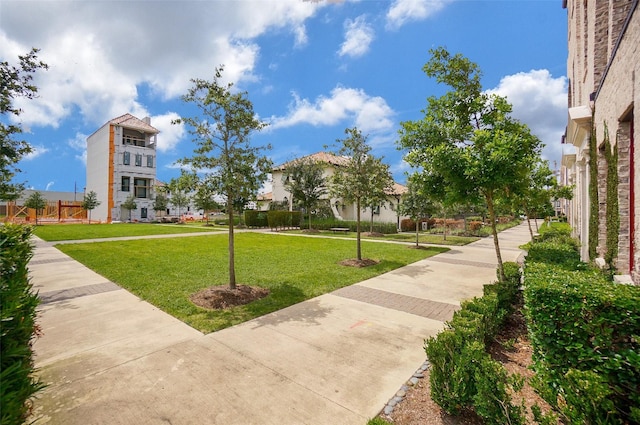 view of home's community featuring a lawn