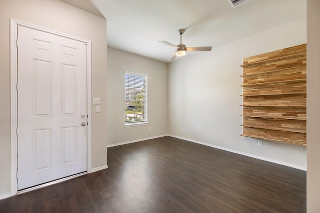 foyer entrance featuring ceiling fan and dark wood-type flooring