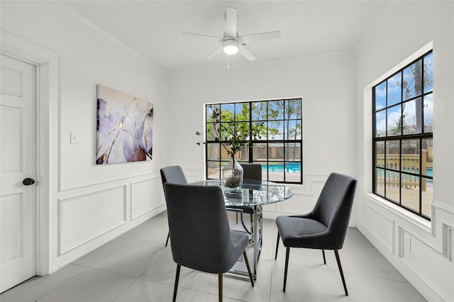 dining area featuring ceiling fan, a healthy amount of sunlight, and light tile patterned flooring