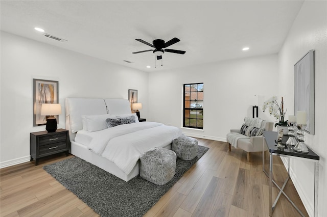 bedroom with hardwood / wood-style flooring and ceiling fan