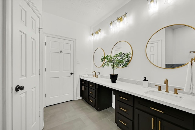 bathroom featuring vanity and a textured ceiling