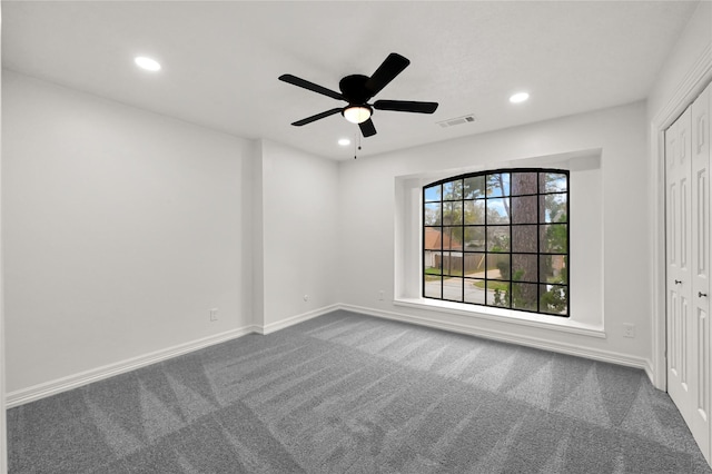 unfurnished room featuring carpet and ceiling fan