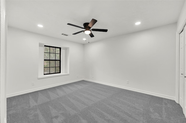 empty room with carpet flooring and ceiling fan