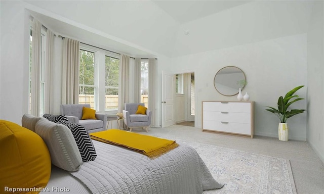 bedroom featuring light colored carpet and vaulted ceiling