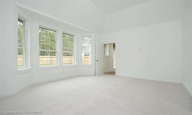 spare room with light colored carpet