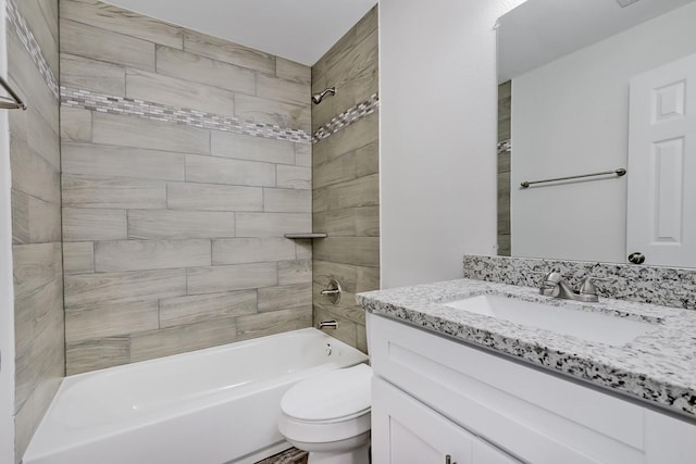 full bathroom with vanity, toilet, and tiled shower / bath