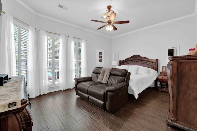 bedroom with dark hardwood / wood-style flooring, ceiling fan, and ornamental molding