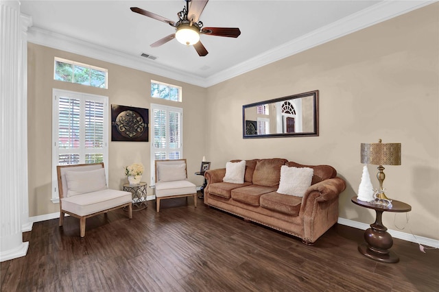 living room with crown molding, ceiling fan, and dark wood-type flooring