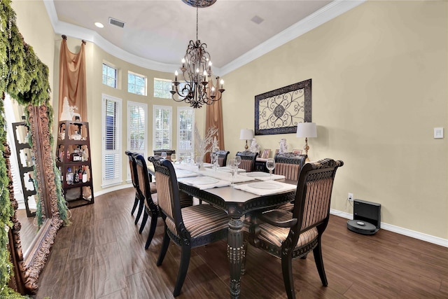 dining area with dark hardwood / wood-style flooring, a notable chandelier, and ornamental molding