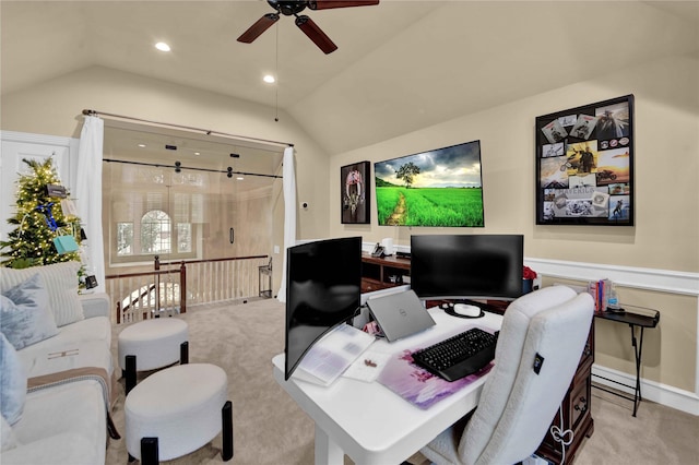 office featuring light carpet, ceiling fan, and lofted ceiling