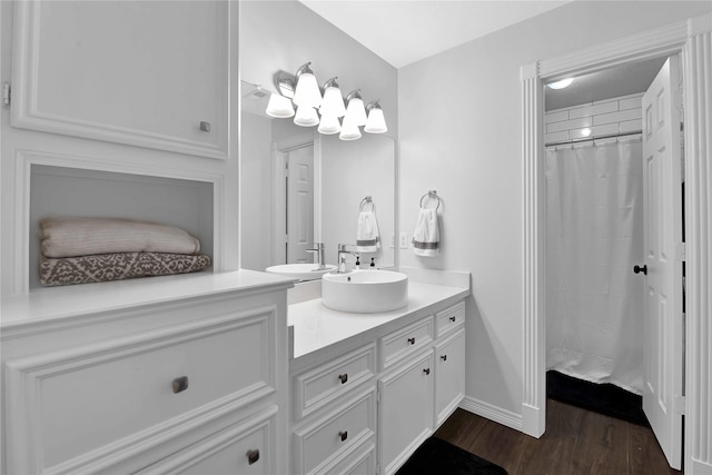 bathroom featuring hardwood / wood-style floors, vanity, and curtained shower