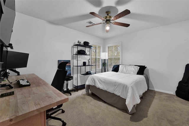 carpeted bedroom with ceiling fan