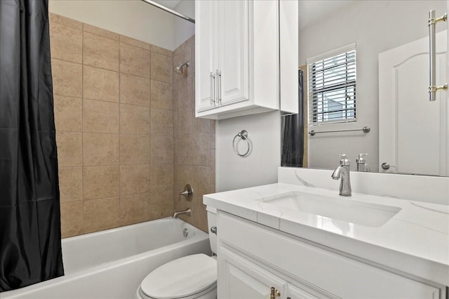 full bathroom with vanity, toilet, and shower / bath combo with shower curtain