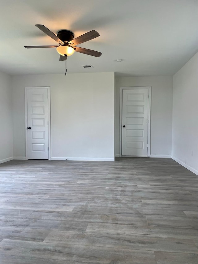 unfurnished room featuring light wood-type flooring and ceiling fan