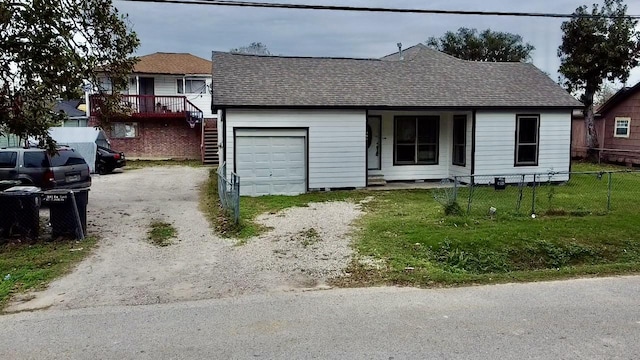 view of front facade with a garage and a front yard