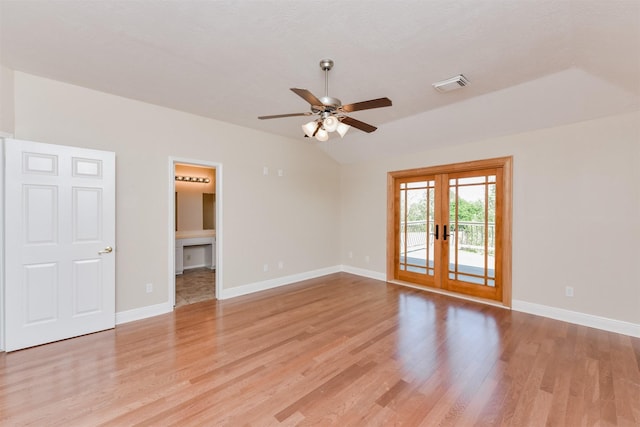 unfurnished room featuring ceiling fan, french doors, lofted ceiling, and light wood-type flooring