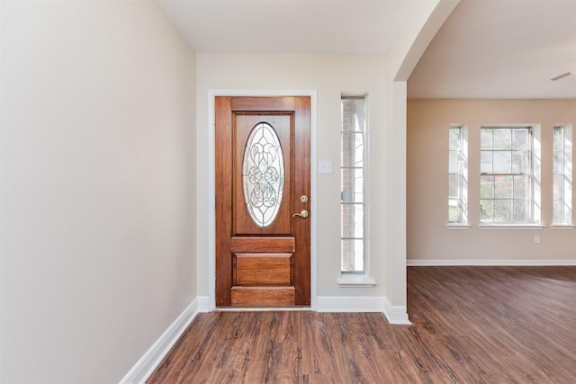 foyer with dark hardwood / wood-style floors