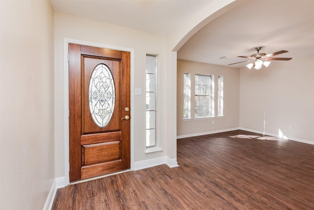 foyer entrance with ceiling fan and dark hardwood / wood-style flooring