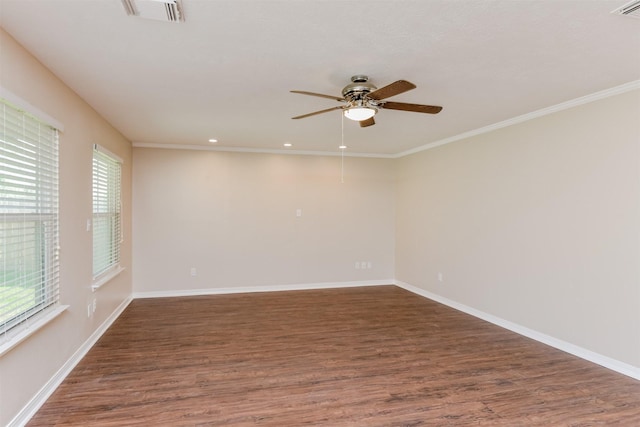 empty room with dark hardwood / wood-style floors, ceiling fan, and crown molding