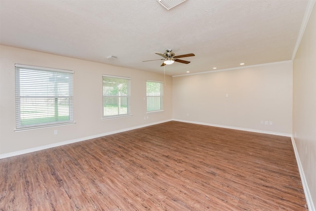 spare room with crown molding, ceiling fan, a textured ceiling, and hardwood / wood-style flooring