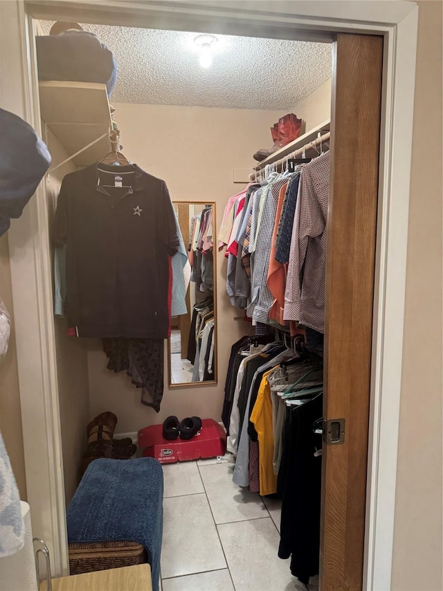 walk in closet featuring light tile patterned floors