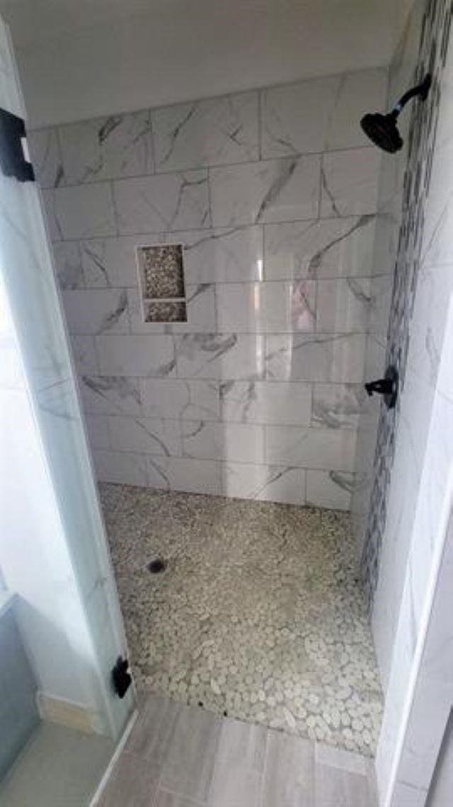 3090 Ethan Symone St, Beaumont, TX 77705 - bathroom with tiled shower